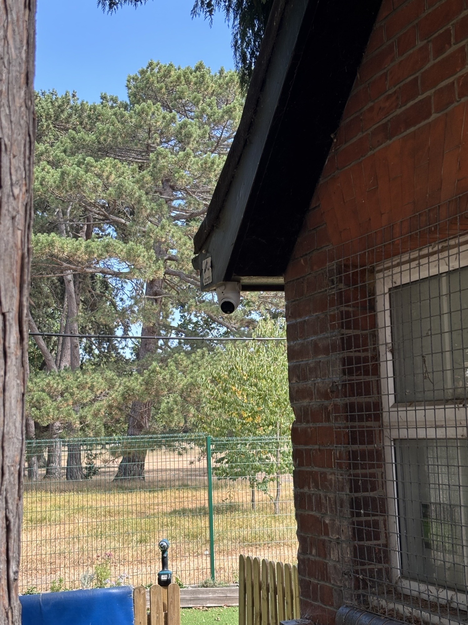 CCTV camera mounted under building eaves